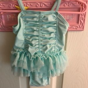 Selling infant girls swimsuits.